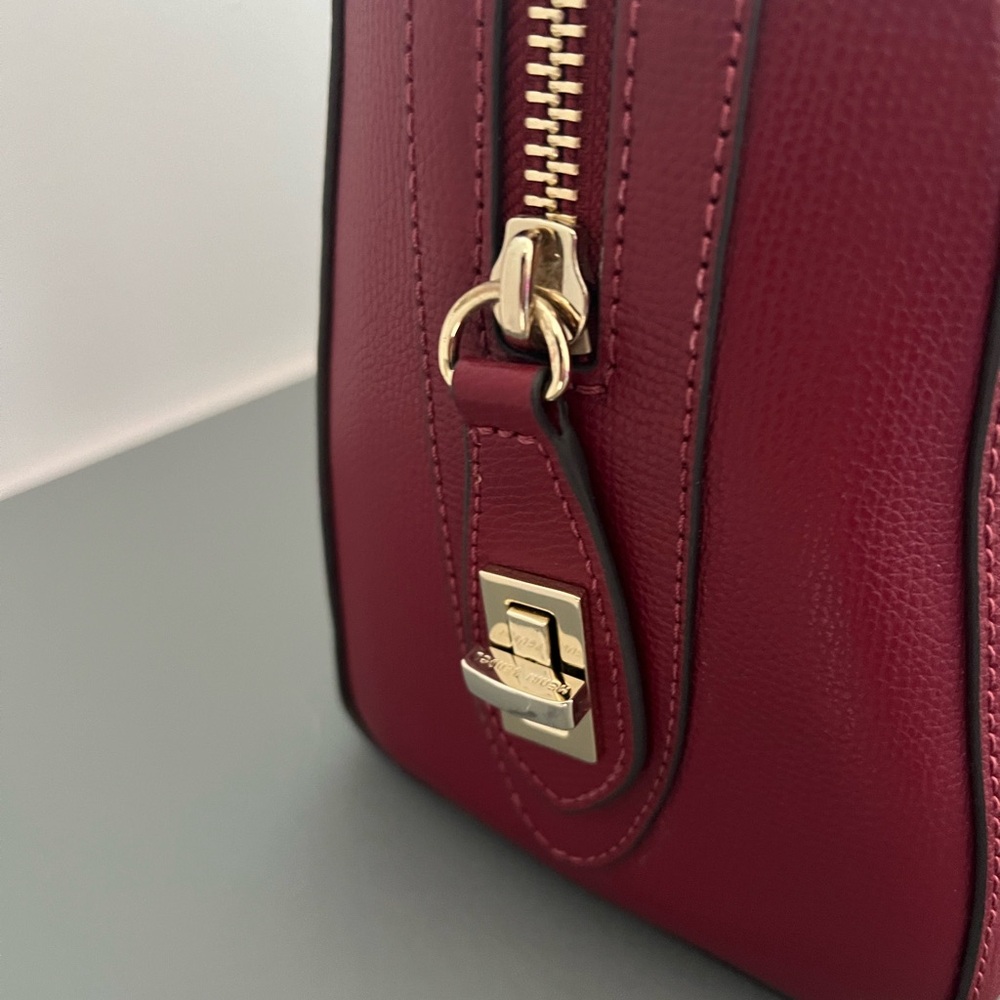Beautiful rich deep red purse. Henri Bendel. With crossbody strap.